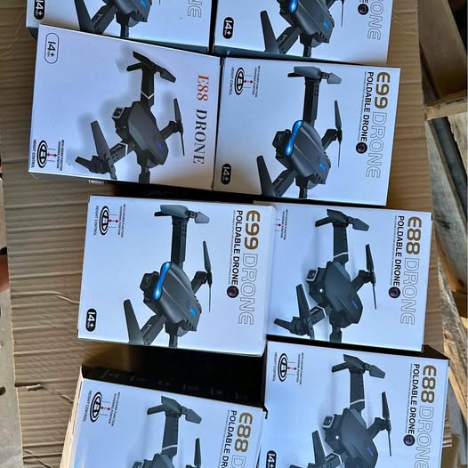 Set of 4K drone retail boxes with printed drone illustrations, blue and black