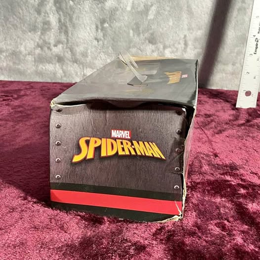 Spider-Man die-cast truck in gray display box with Marvel logo and Spider-Man text