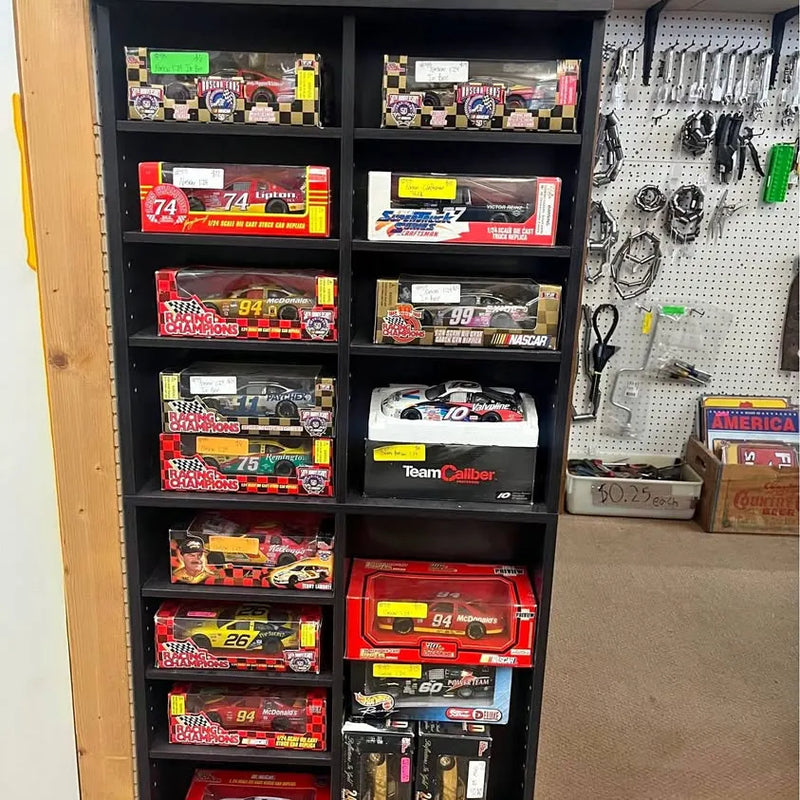 NASCAR 1:24 diecast car set in a wall display, with multiple red race cars