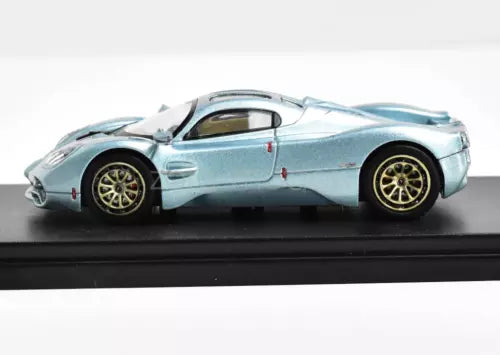 Light blue 1:64 diecast racing sports car model, side view, metal parts