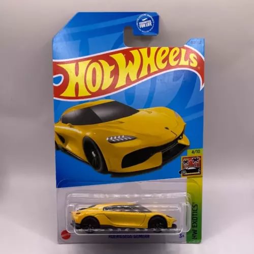 Yellow die-cast toy sports car in blister pack, Hot Wheels Koenigsegg