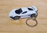 Diecast model car keychain with white sports car and metal keyring