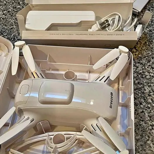 Yuneec Breeze 4K drone in open box, propellers and camera housing visible