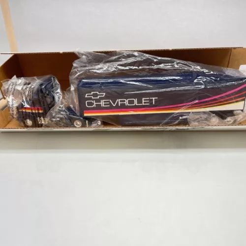 Ertl 1:64 diecast Kenworth semi truck, blue with Chevrolet logo, in box