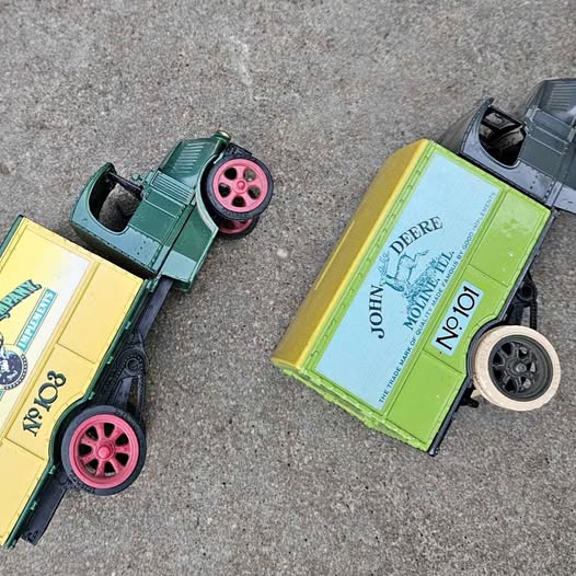 Diecast bank truck replicas: yellow and dark green, with John Deere-style box print
