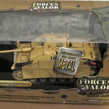 Diecast tank model in clear retail box, tan armored vehicle front