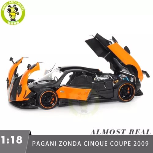 Orange and black Pagani Zonda Cinque diecast model car with open hood, 1:18 scale