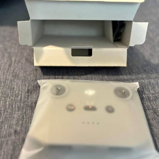DJI RC remote controller front panel with buttons and small display