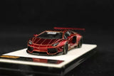 Red diecast sports car model with black wheels, front 3/4 view
