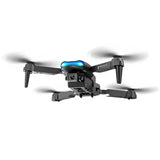 Beginner quadcopter drone with four propellers and blue LED accents