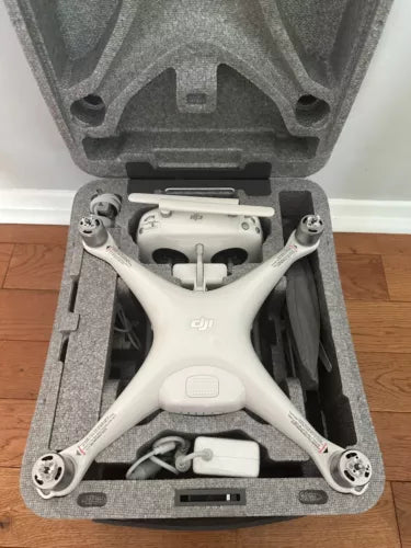 DJI Phantom 4 Pro quadcopter drone in open hard case, white body with four arms