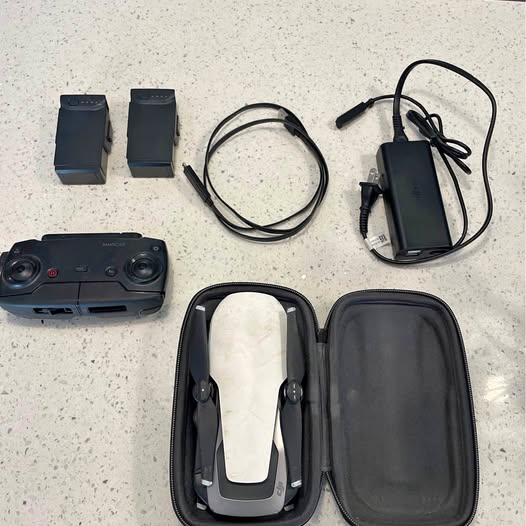 DJI Mavic Air drone accessories kit with controller, batteries, cables, and zip case