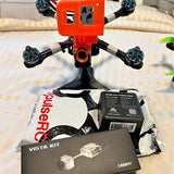 5-inch FPV drone frame with propellers and Vista Kit components, orange/black