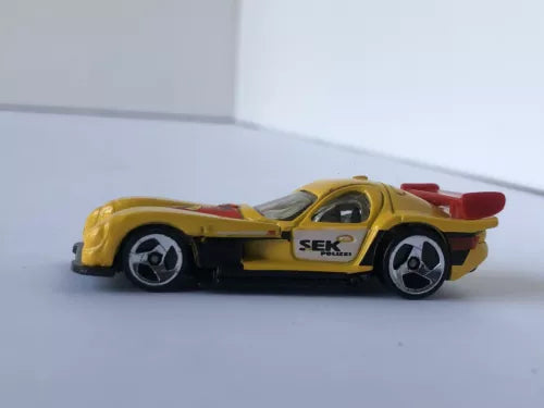 Yellow and red diecast model car, PANOZ GTR-1 style, 1:64 scale, detailed wheels