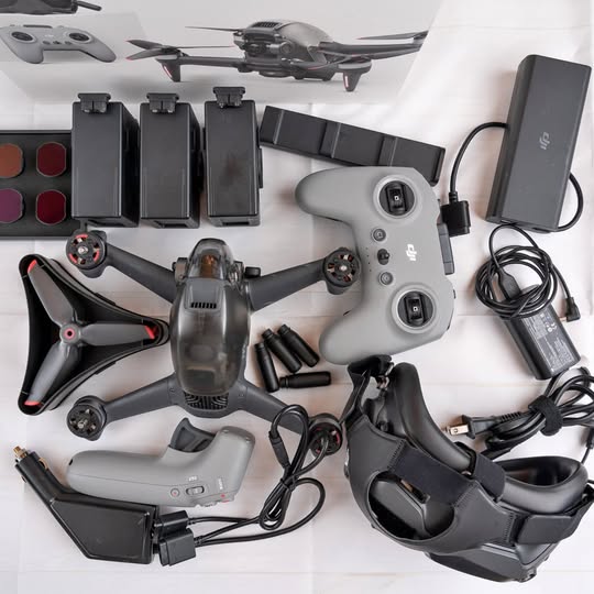 DJI FPV drone system with motion controller, handheld controller, batteries, cables and charger