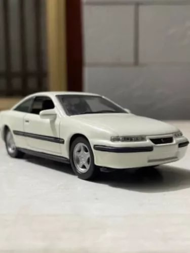 White 1:43 diecast car model with detailed front grille and headlights