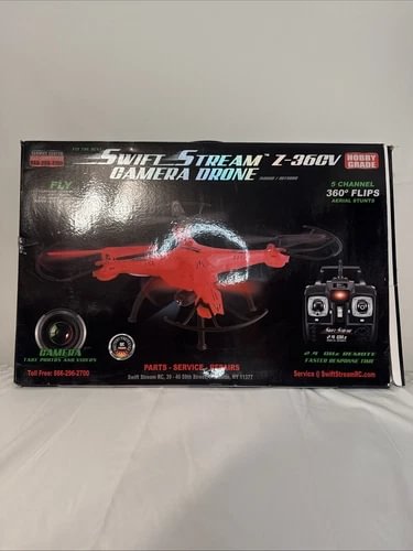 R/C camera drone kit box with red quadcopter and remote control