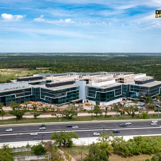 Aerial drone photo of a modern office complex and surrounding roads