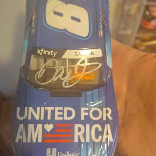 Blue diecast race car hood with xfinity and Dale Jr decals and United for America text