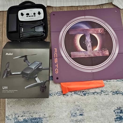 Ruko drone kit with gray drone, remote controller, and storage case