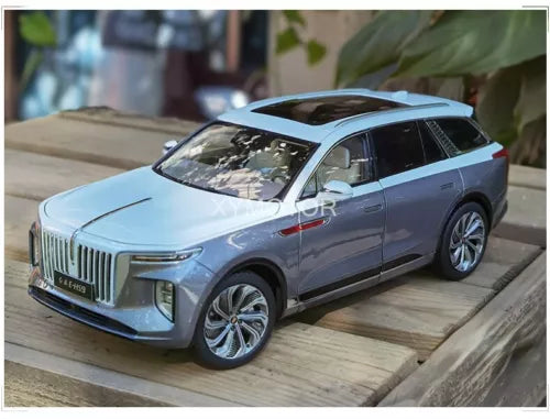 Light blue diecast SUV model car with detailed grille and side mirrors
