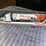 Ashley Force diecast transporter toy truck with white cab and black trailer