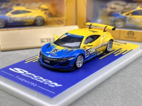 Diecast metal sports car model, blue and yellow race car with #95 on hood