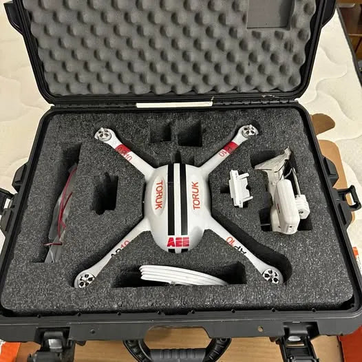 Hard shell drone repair tool kit case with foam inserts and tools