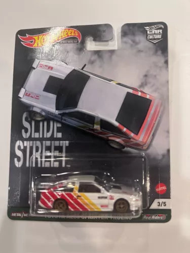 White 1:64 die-cast toy car with red and yellow racing stripes, black windows.