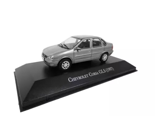 Gray 1/43 diecast sedan model of Chevrolet Corsa GLS (1997) on display base