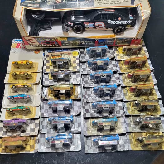 Diecast race cars set, multiple boxed cars on display