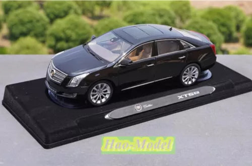 Alloy diecast model car, dark blue Cadillac XTS 2014, on display base