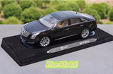 Alloy diecast model car, dark blue Cadillac XTS 2014, on display base