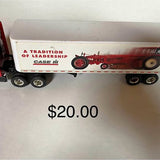 Diecast semi tractor trailer toy with white box and red Case logo, multiple wheels
