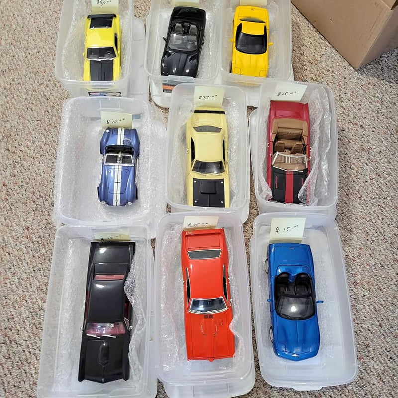 1:18 diecast model car set in blister tray, multiple cars in black, red, blue, yellow
