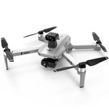 White quadcopter drone with four propellers and front camera module.