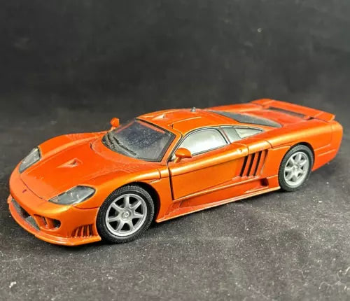 1/24 scale diecast sports car, burnt orange with silver wheels and open hood details
