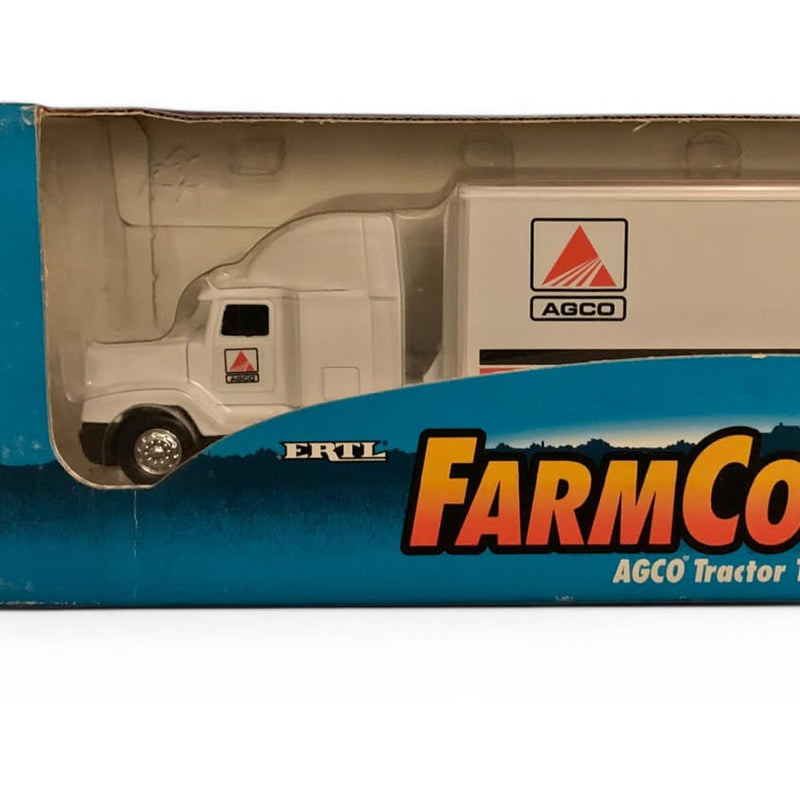 AGCO ERTL farm country diecast tractor trailer model with white cab and blue trailer