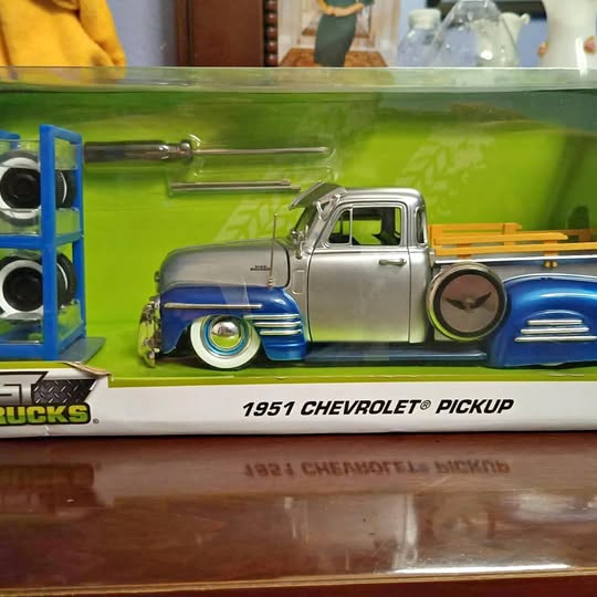Diecast pickup truck model, silver and blue 1951 Chevrolet