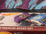 Purple diecast model car, open hood and detailed wheels on boxed set