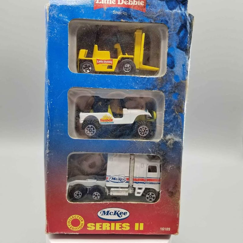 Diecast car set in blister pack with three vehicles: yellow, white, and red-white