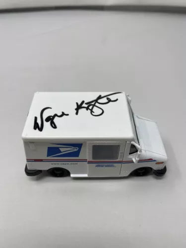 Signed white USPS post office diecast car, 1:36 scale, hood autograph, side decals