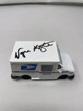 Signed white USPS post office diecast car, 1:36 scale, hood autograph, side decals