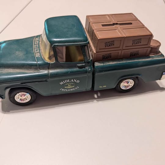 Die-cast bank truck with green cab and brown crate bank container, Midland logo on side