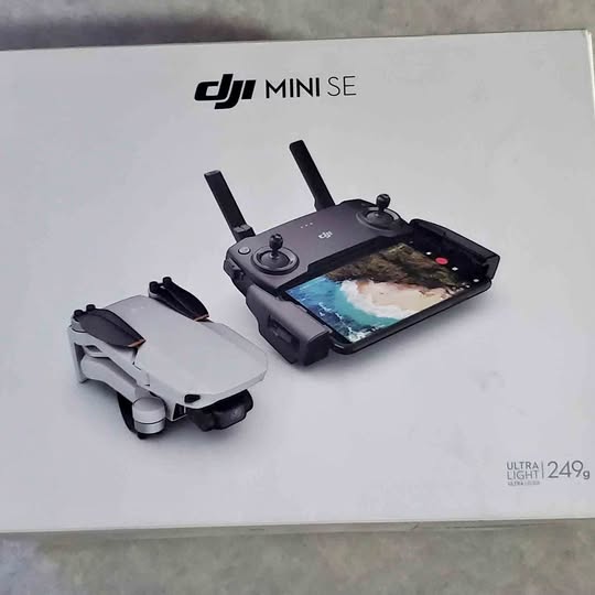 DJI Mini SE drone and controller with attached screen on retail box