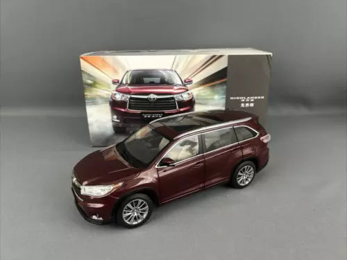 Maroon 1/18 scale SUV diecast model, front-right view, detailed grille