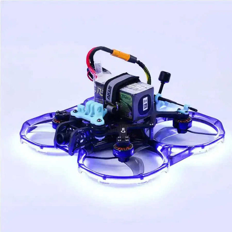 FPV mini racing drone with blue LED ring, four ducted propellers, compact frame