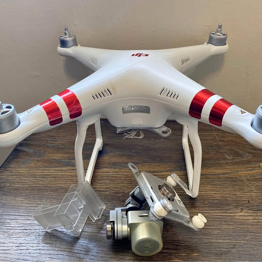 White quadcopter drone with red stripes, front camera gimbal and landing gear