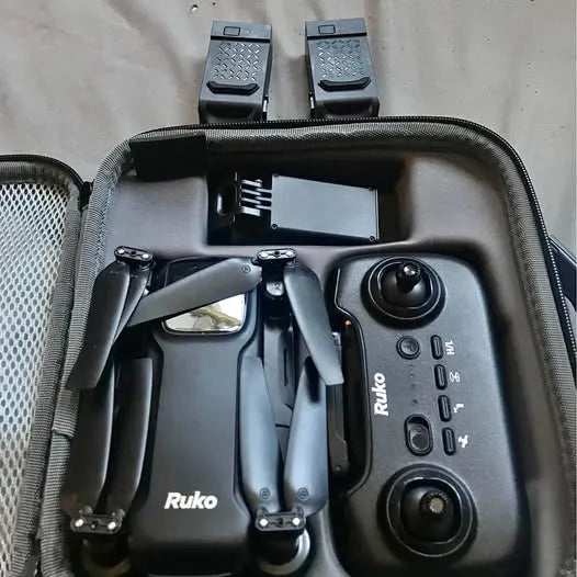 Ruko drone with controller and folded propellers in a protective case
