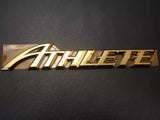 Metallic gold “HobbyElite” logo decal on dark background